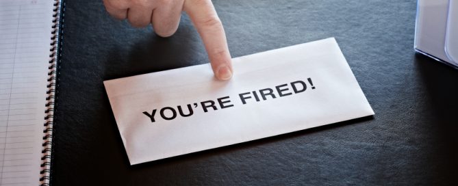 finger pointing at letter on office desk